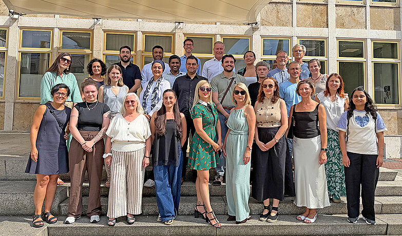 Gruppenfoto mit den Mitgliedern des Internationalen Beirats