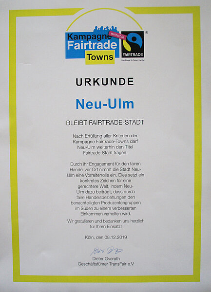 Urkunde mit dem Text "Urkunde - Neu-Ulm bleibt Fairtrade-Stadt"