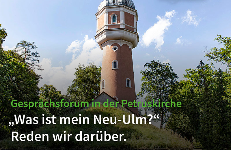 Foto Neu-Ulmer Wasserturm mit Beschriftung: Gesprächsforum in der Petruskirche "Was ist mein Neu-Ulm?"